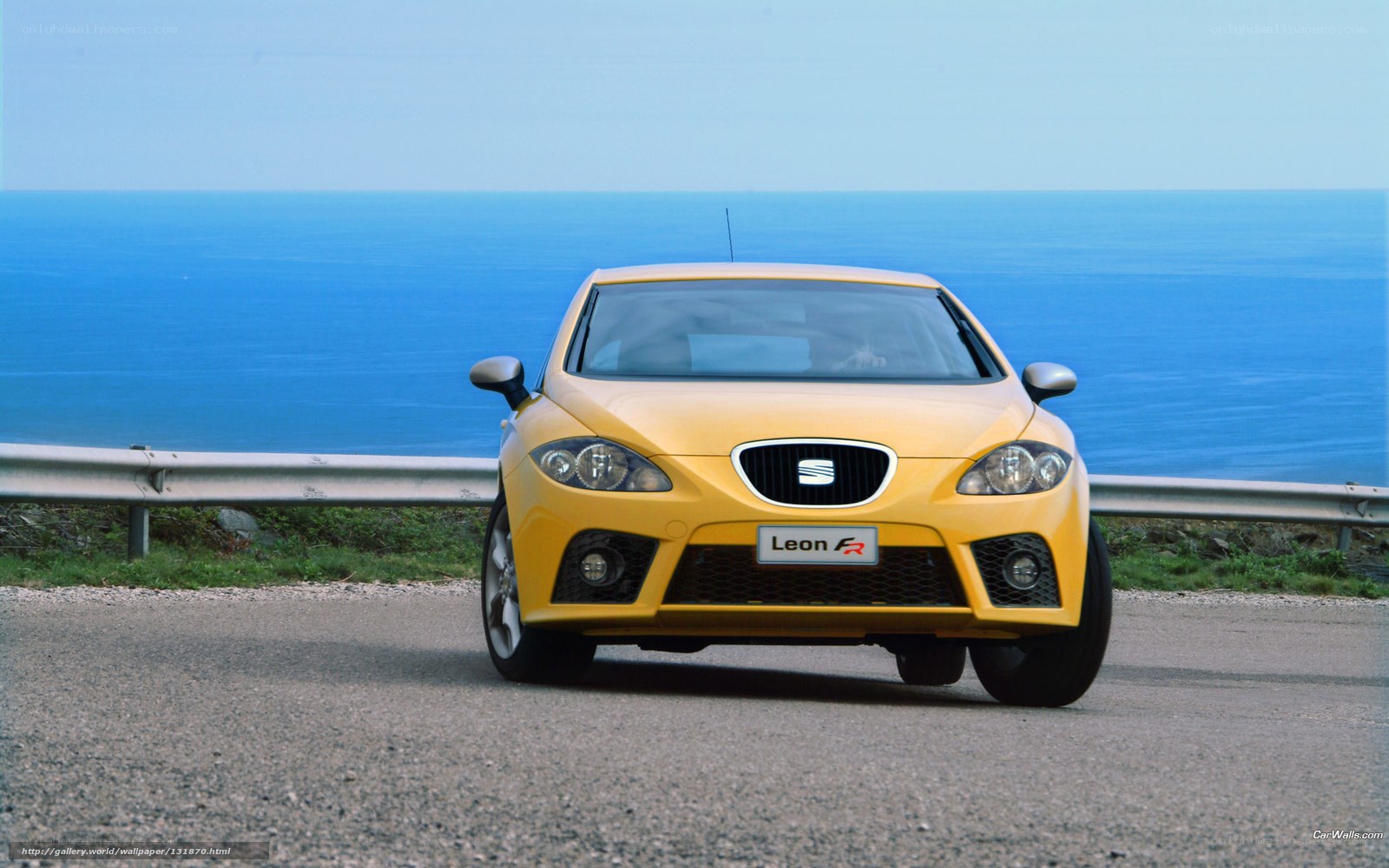 Yellow SEAT Leon FR by the sea