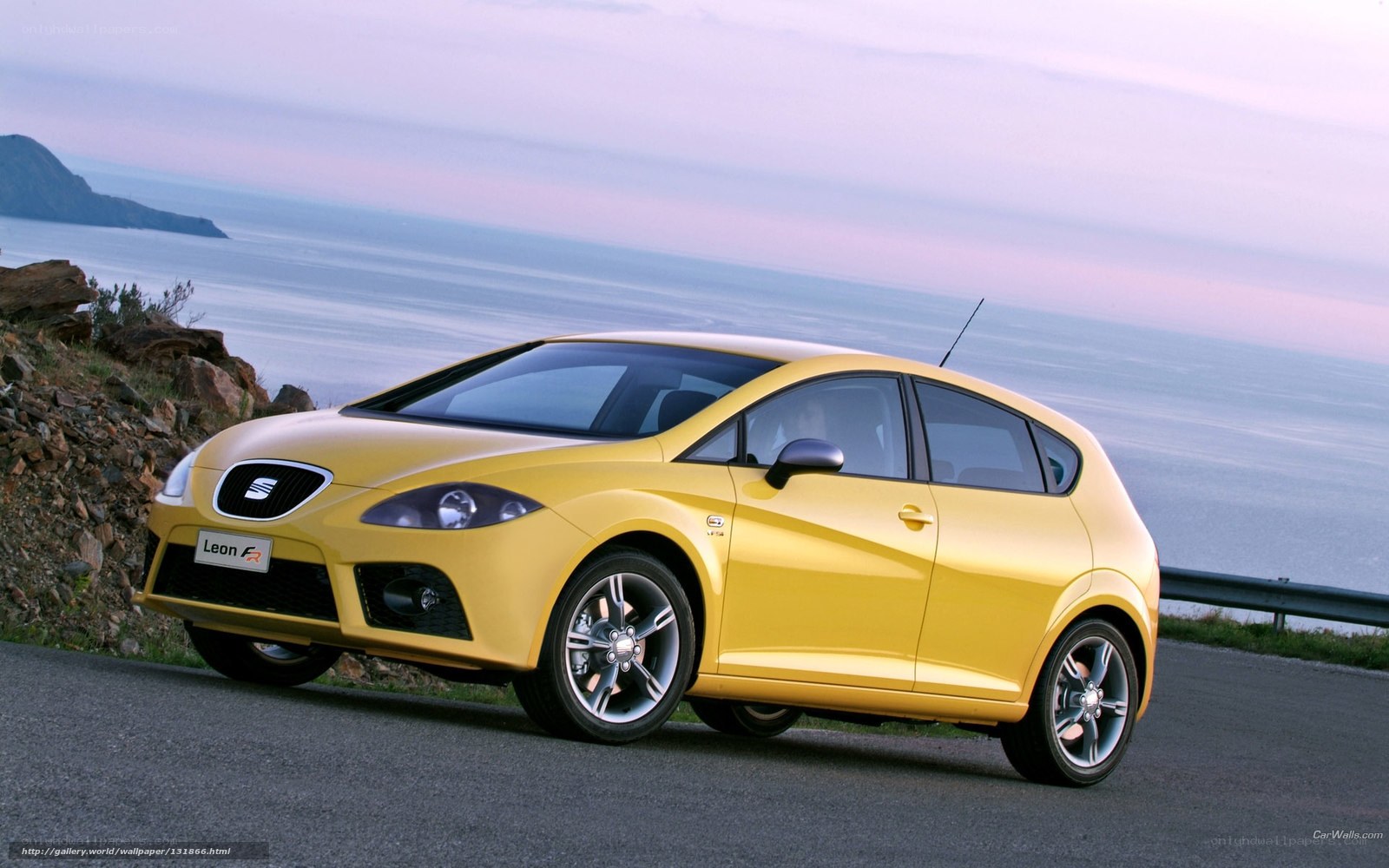 Yellow SEAT Leon FR car