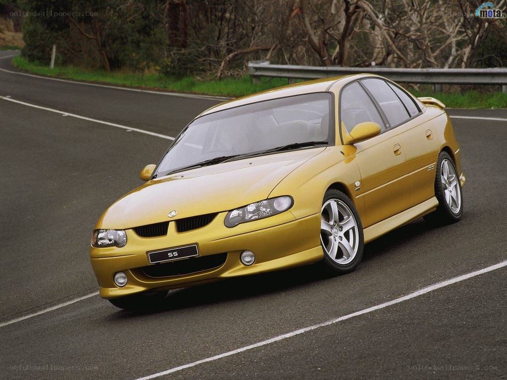 yellow sedan on a road