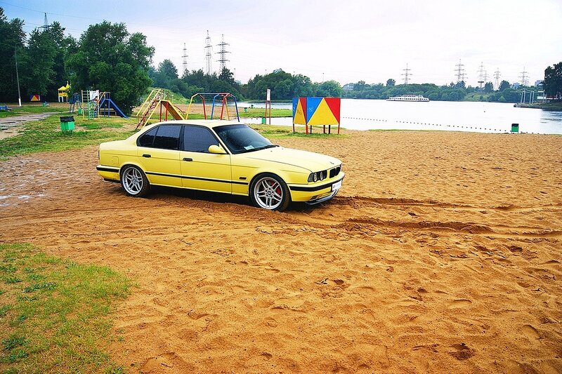 Yellow Sedan on Sand