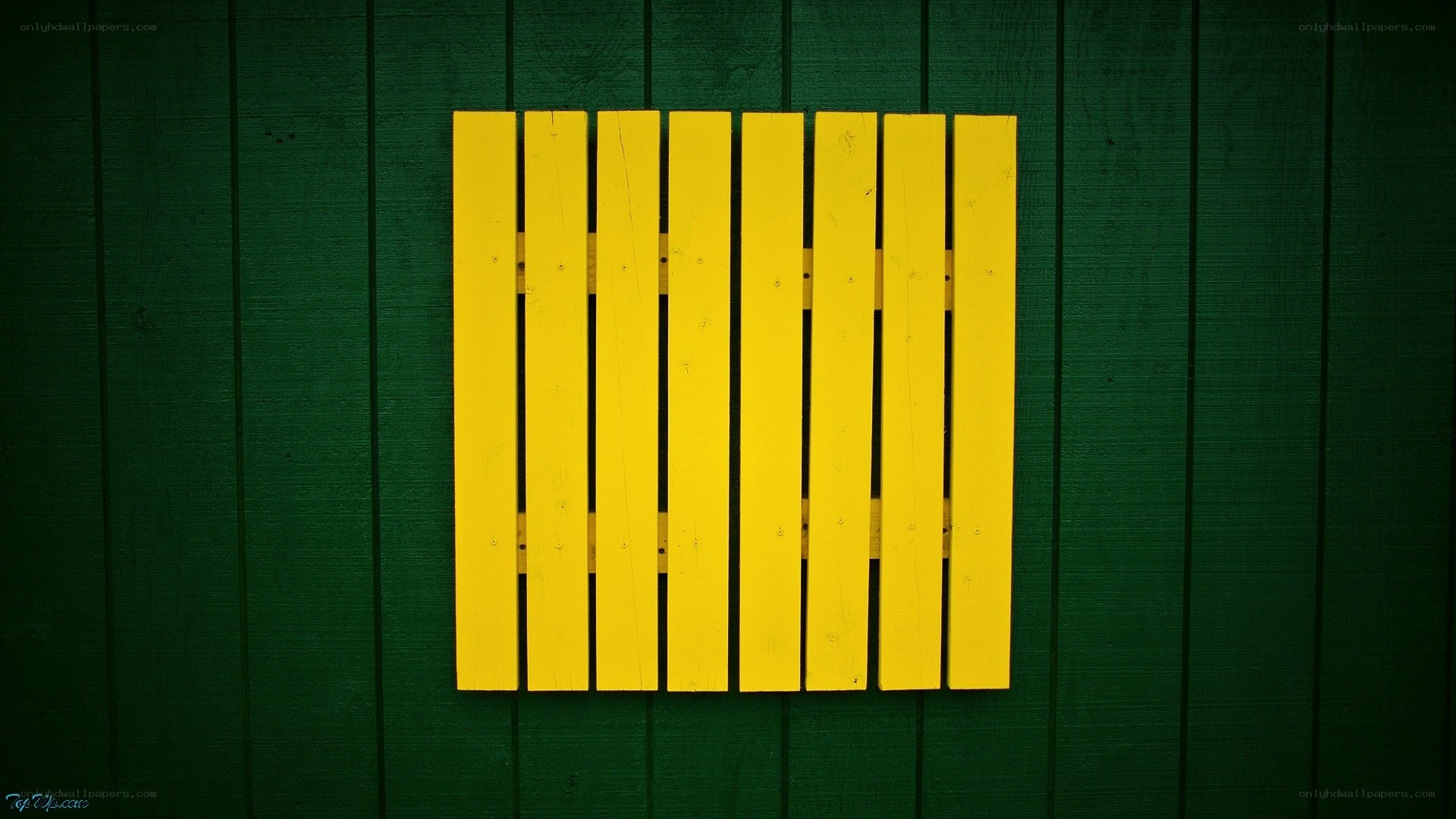yellow slats on green wall