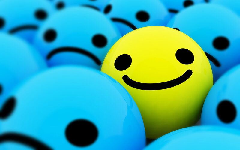 yellow smiley among blue frowns