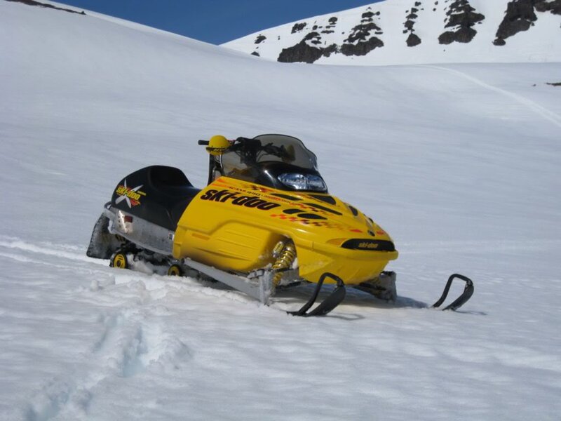 Yellow Snowmobile on Slope