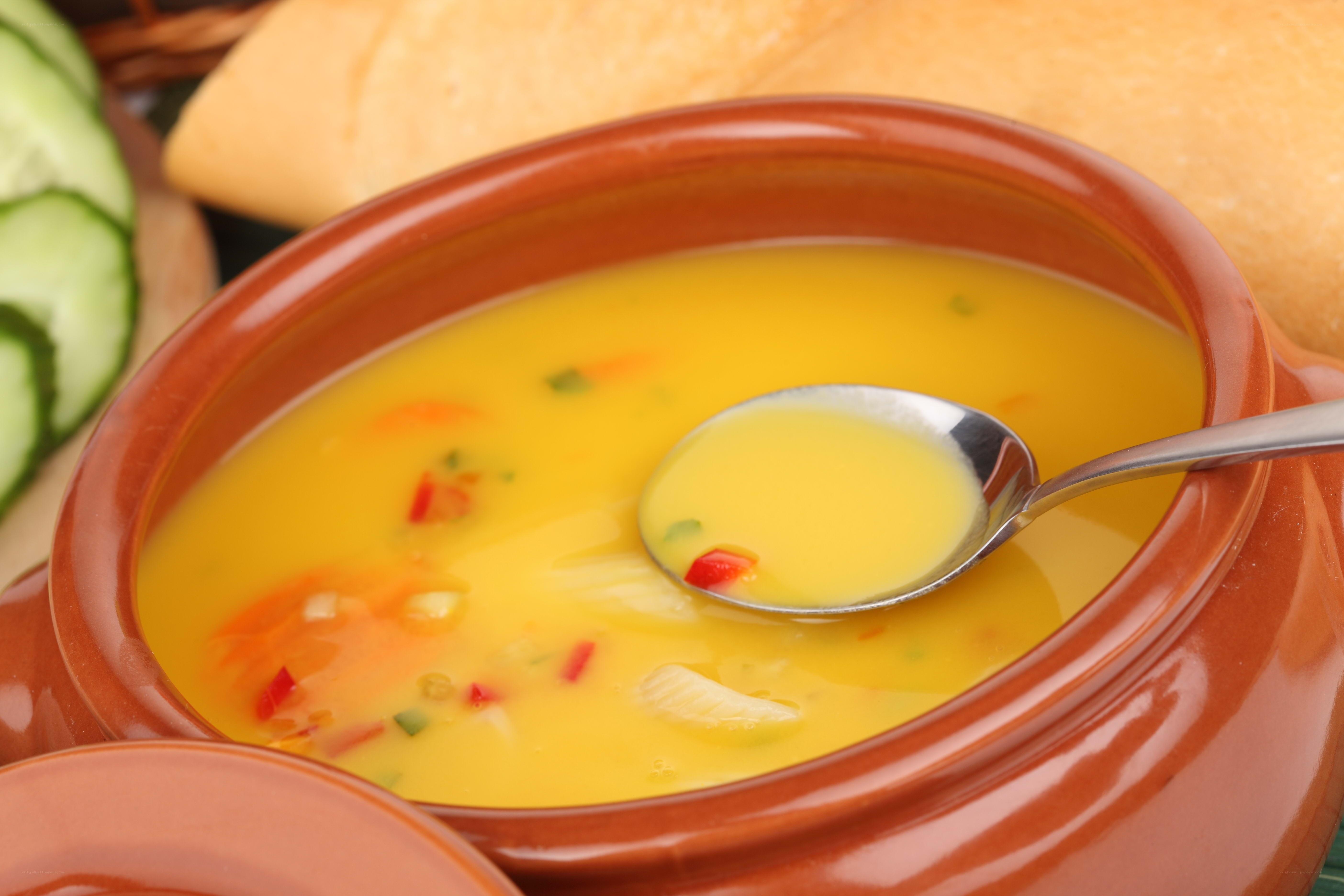 yellow soup in a clay bowl