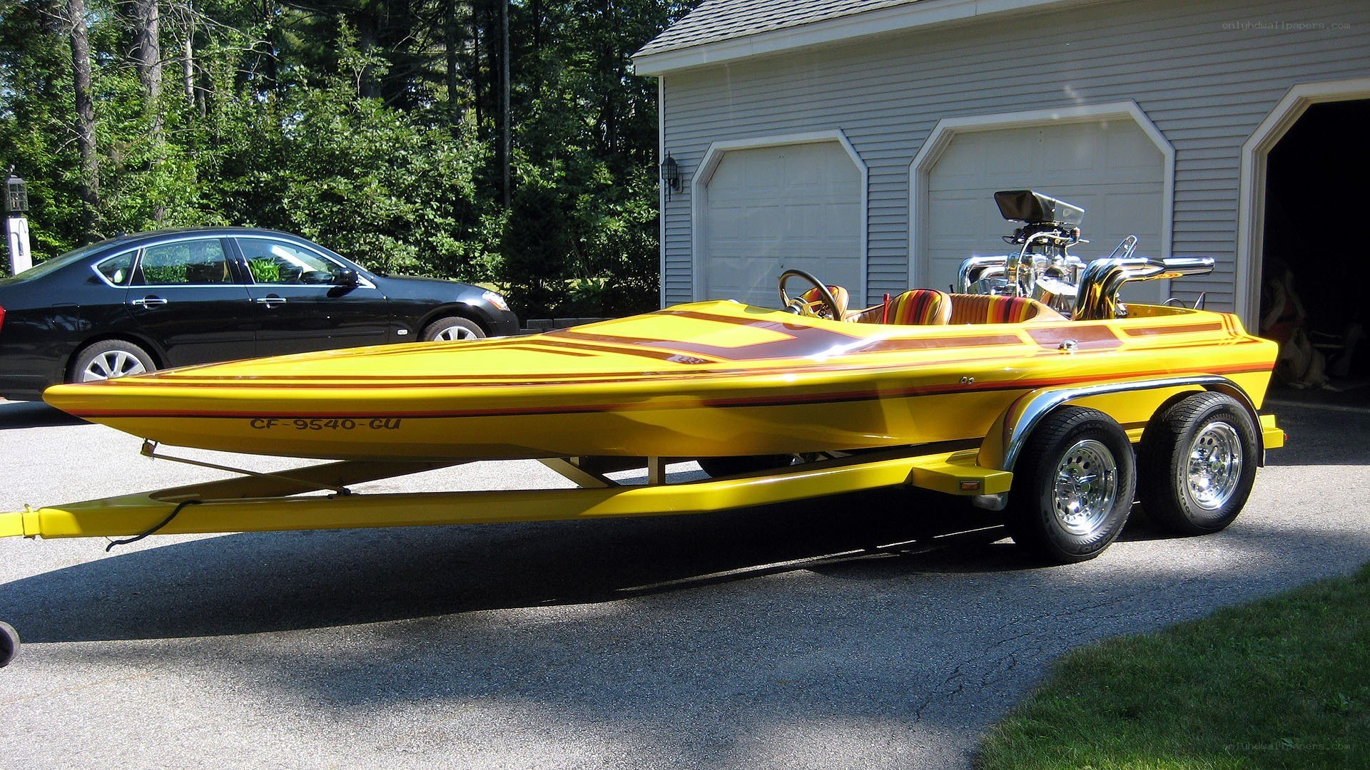 yellow speedboat on trailer