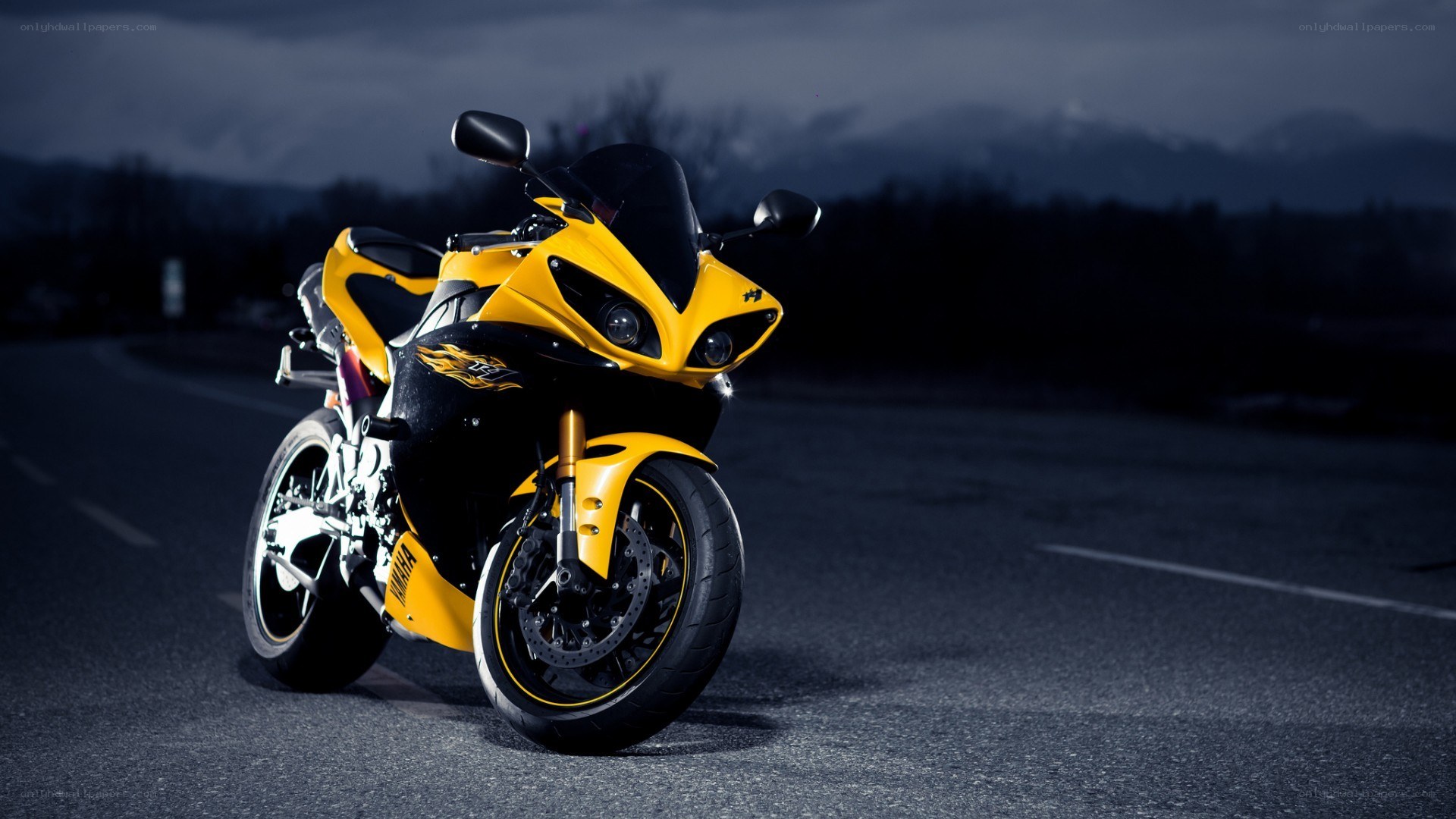 yellow sport motorcycle at night