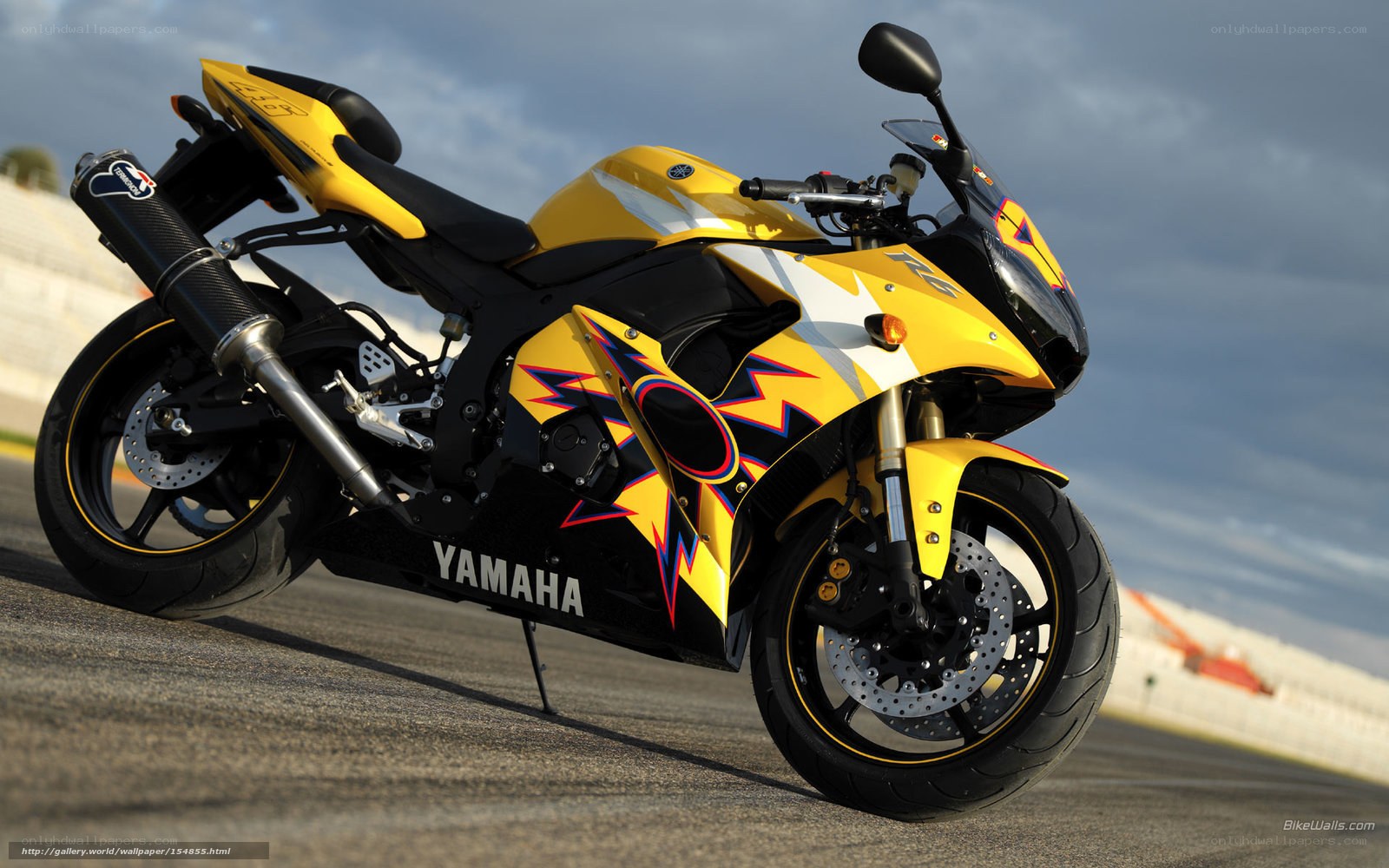yellow sport motorcycle on track
