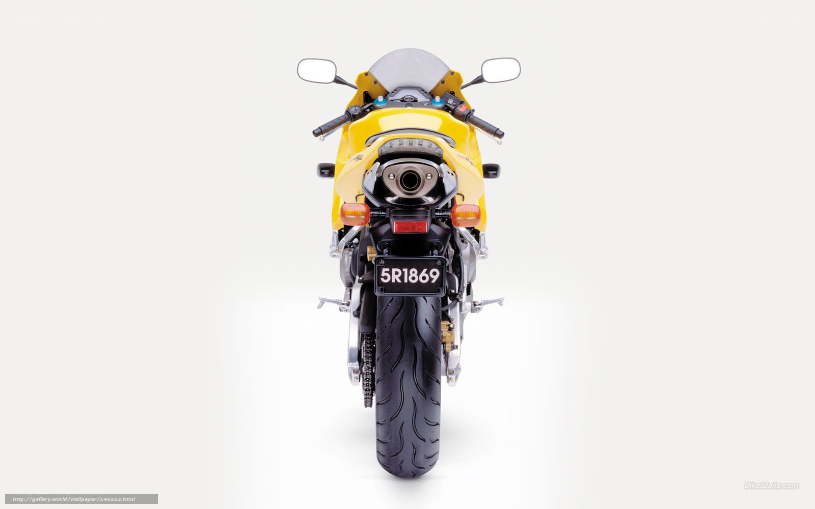 yellow sport motorcycle rear view