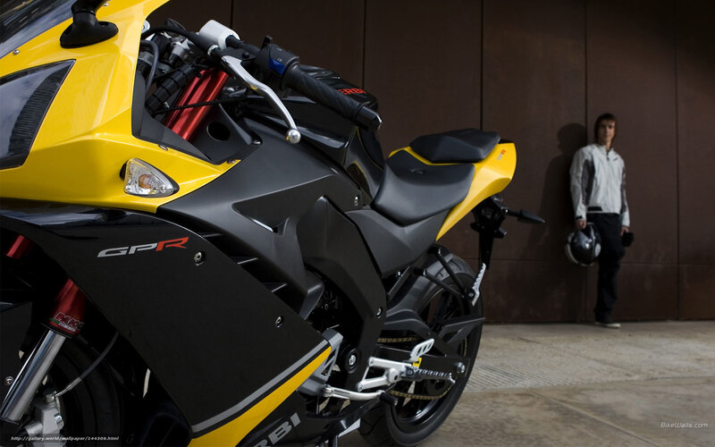 Yellow sport motorcycle with rider