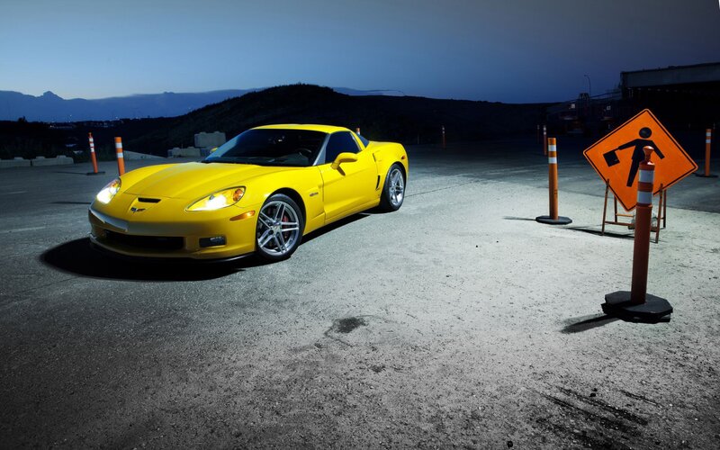 Yellow sports car at dusk