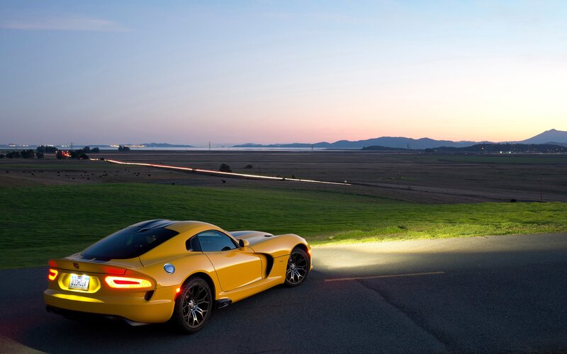 Yellow sports car at dusk