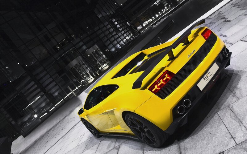 yellow sports car at night