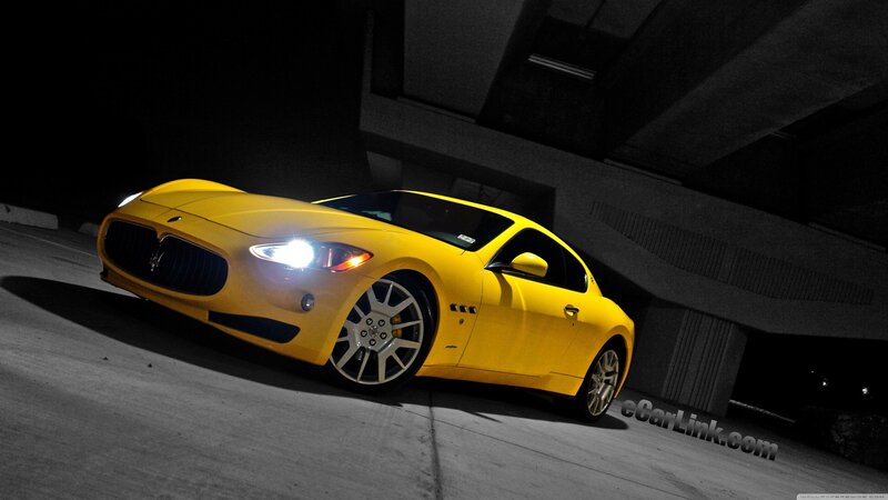 yellow sports car at night