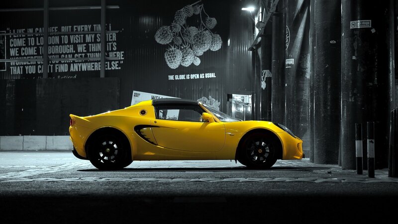 Yellow sports car at night