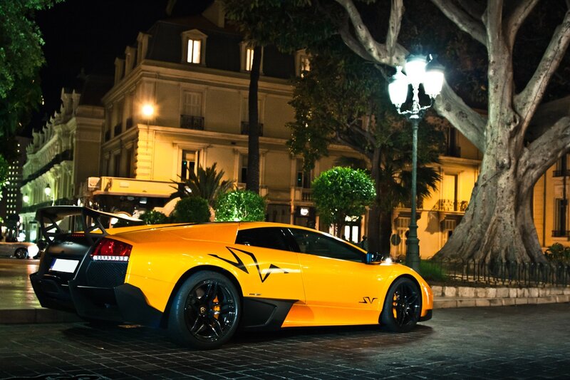 Yellow sports car at night