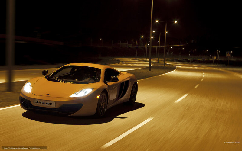 Yellow sports car at night