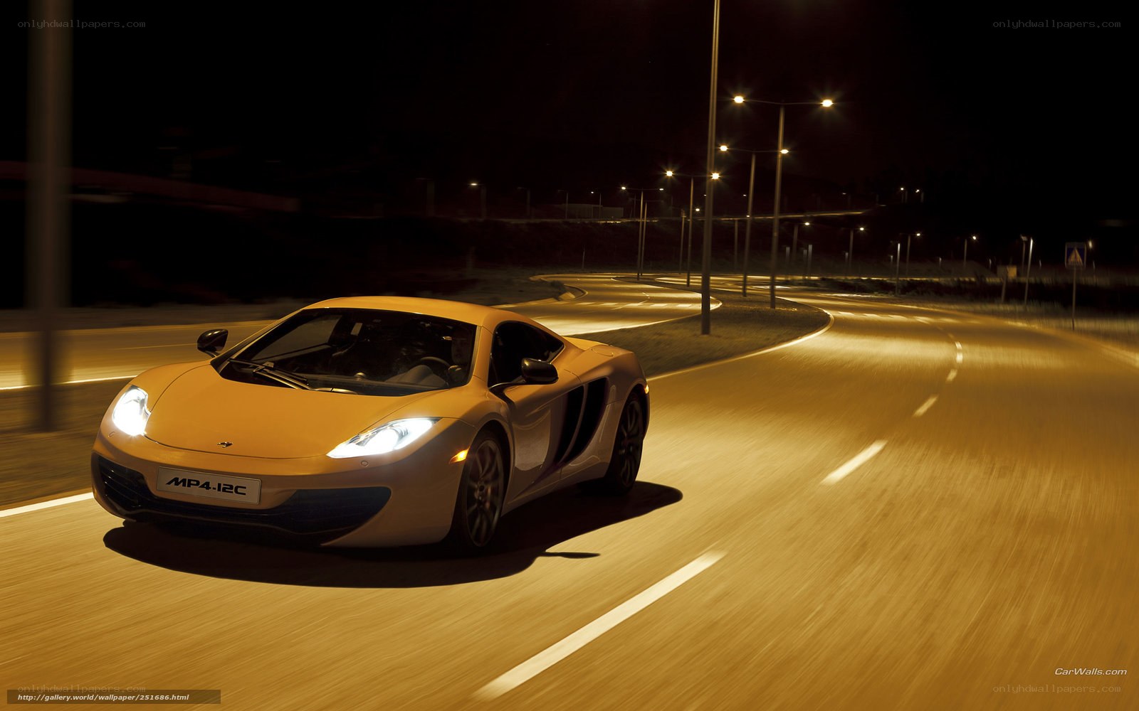 Yellow sports car at night