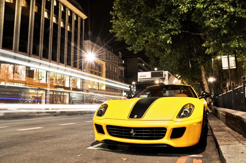 Yellow sports car at night