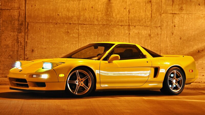 yellow sports car at night