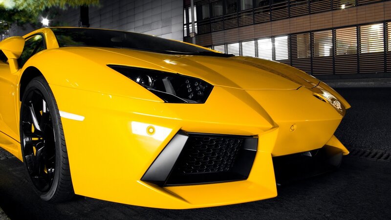 yellow sports car at night