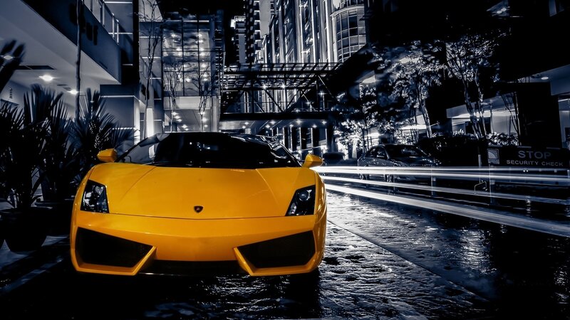 yellow sports car at night