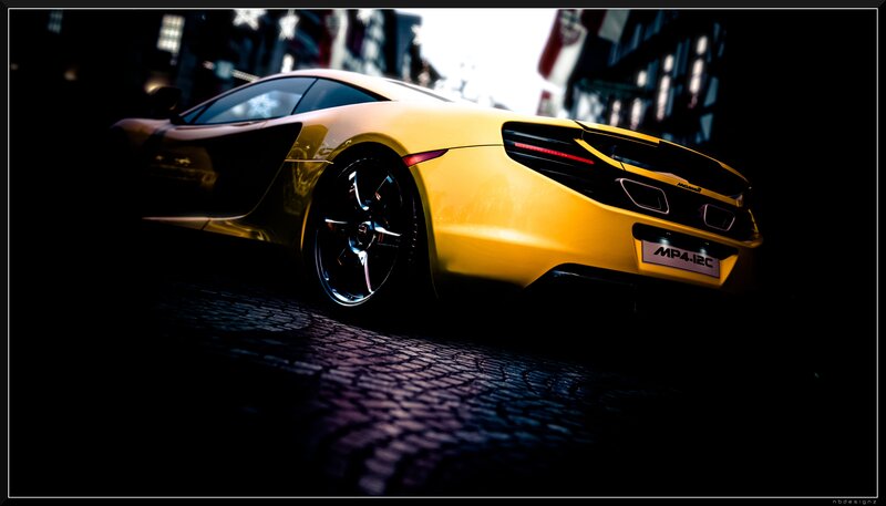 yellow sports car at night