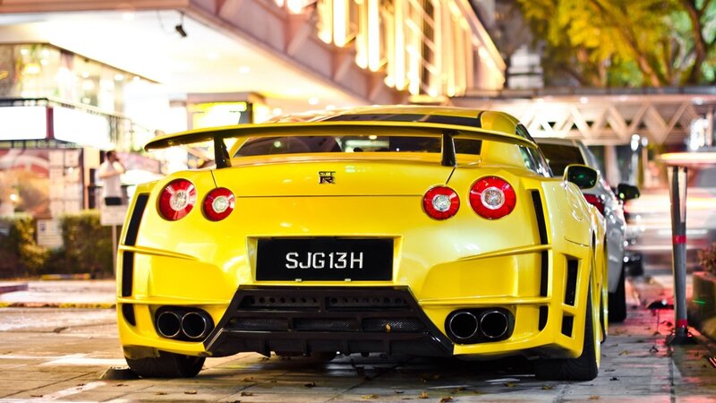 yellow sports car at night