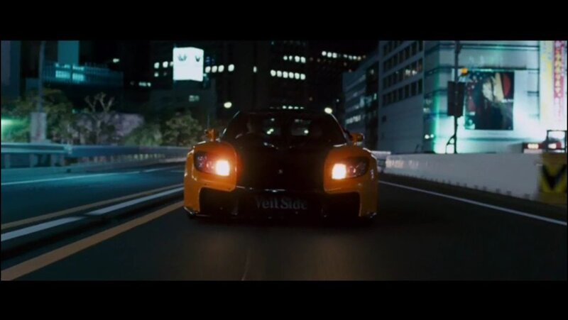 yellow sports car at night