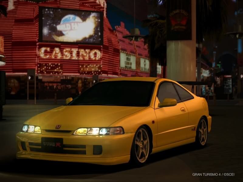 yellow sports car at night