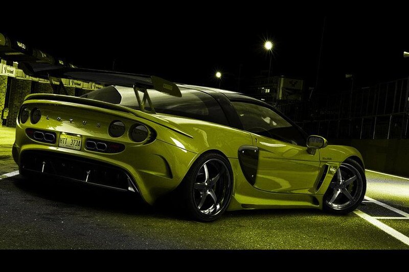 yellow sports car at night