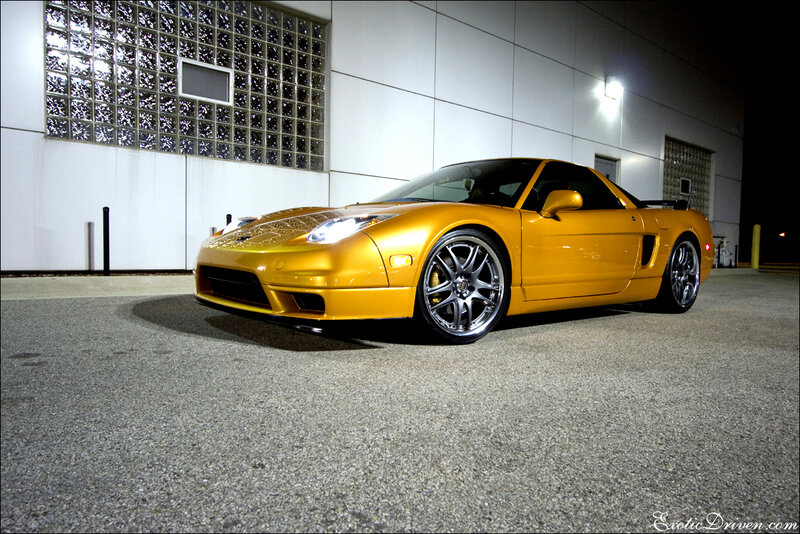 Yellow sports car at night