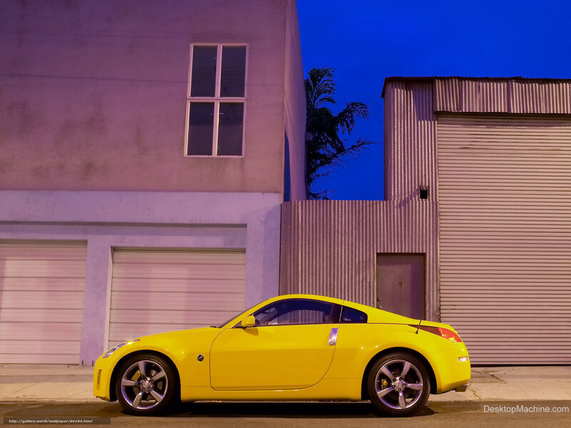 yellow sports car at night