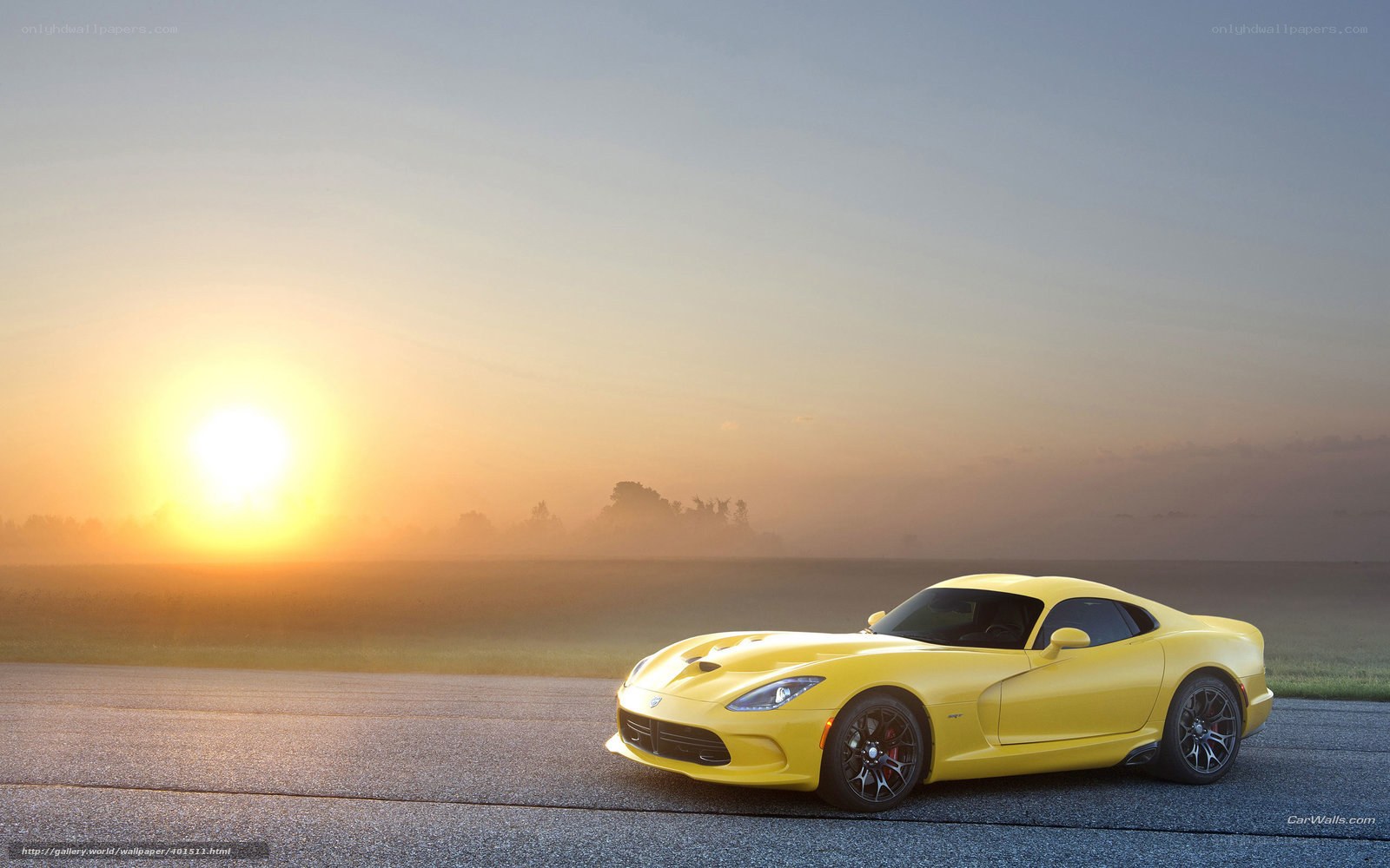 Yellow sports car at sunrise