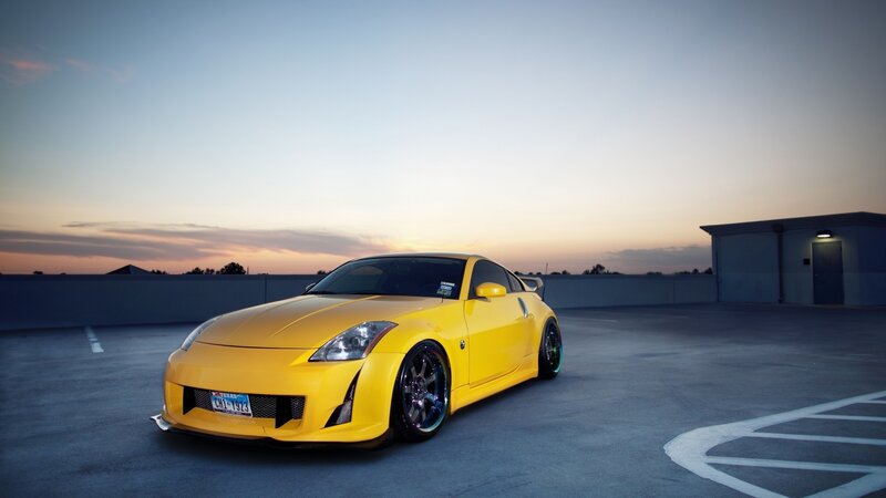 yellow sports car at sunset