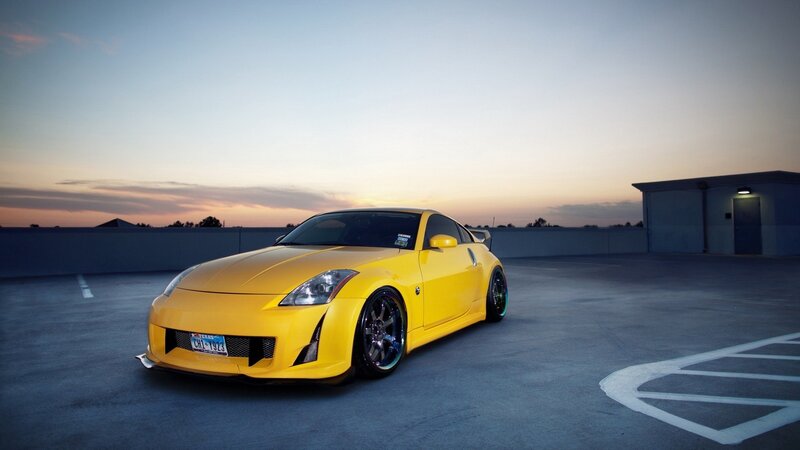Yellow sports car at sunset