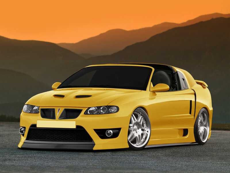 Yellow sports car at sunset