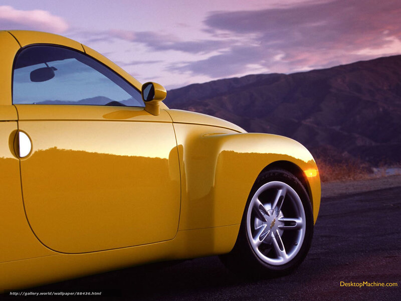 Yellow sports car at sunset