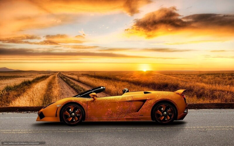 Yellow sports car at sunset
