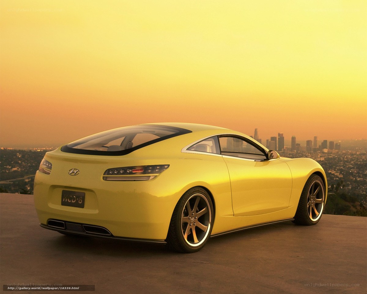 Yellow sports car at sunset