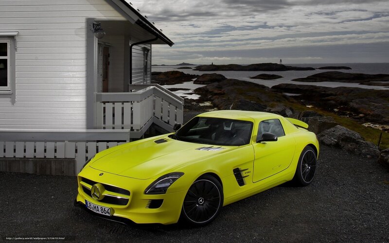 Yellow sports car by the sea