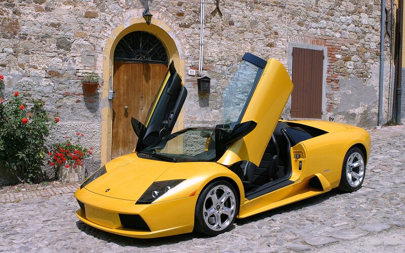 Yellow Sports Car — Calm, Afternoon, Photograph, Stone Building
