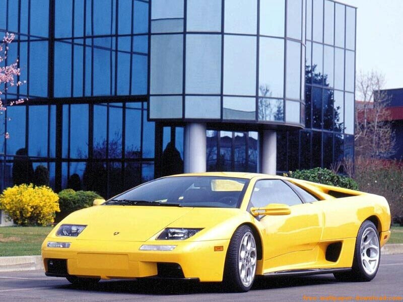 Yellow Sports Car — Calm, Spring, Photograph, Building, Bushes