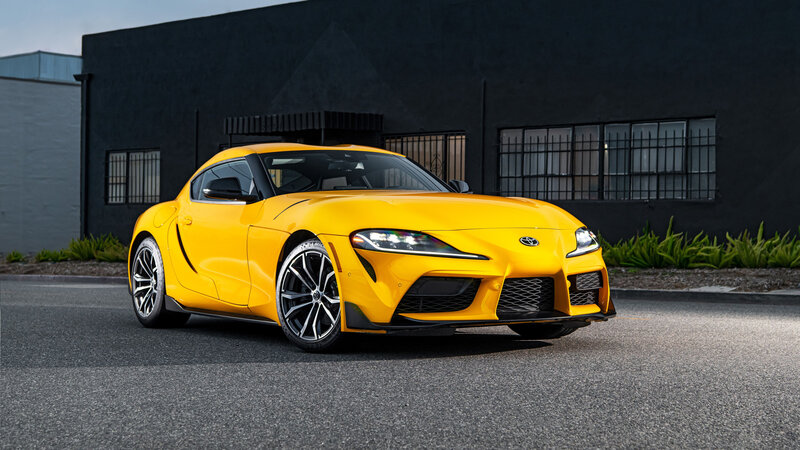 Yellow Sports Car — Dramatic, Afternoon, Photograph, Building, Asphalt