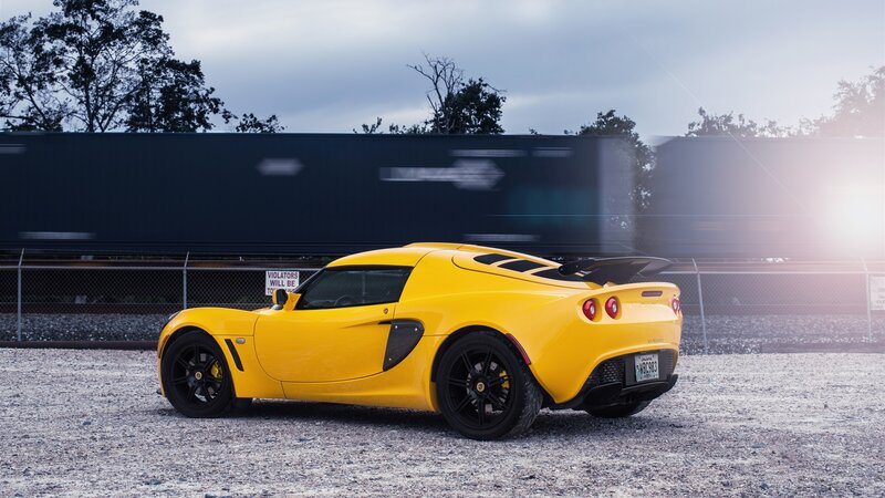Yellow Sports Car — Dramatic, Afternoon, Photograph, Train