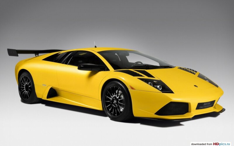 Yellow Sports Car — Dramatic, Photograph, Black Wheels, Rear Wing