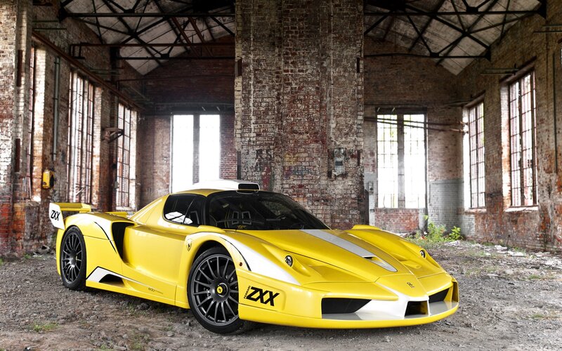 Yellow Sports Car — Dramatic, Photograph, Brick Building