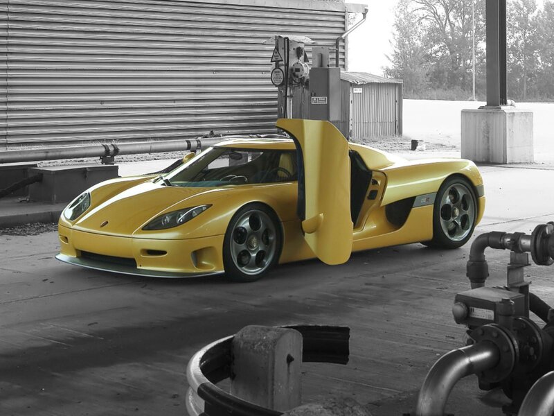 Yellow Sports Car — Dramatic, Photograph, Building, Pipes