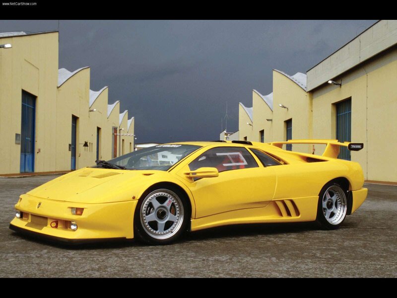 Yellow Sports Car — Dramatic, Photograph, Building