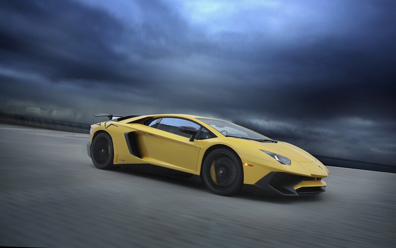 Yellow Sports Car — Dramatic, Photograph, Race Track, Dark Sky