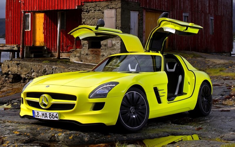 Yellow Sports Car — Dramatic, Photograph, Red Building